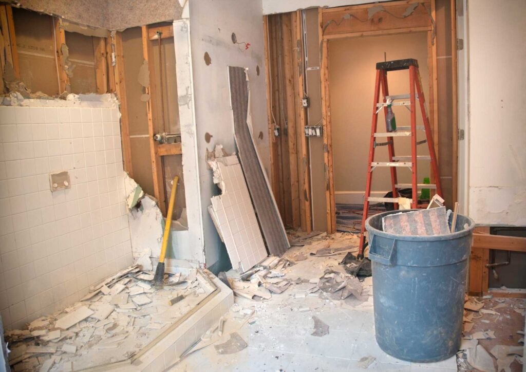Average cost to gut and remodel a house showing interior stripped to studs during renovation