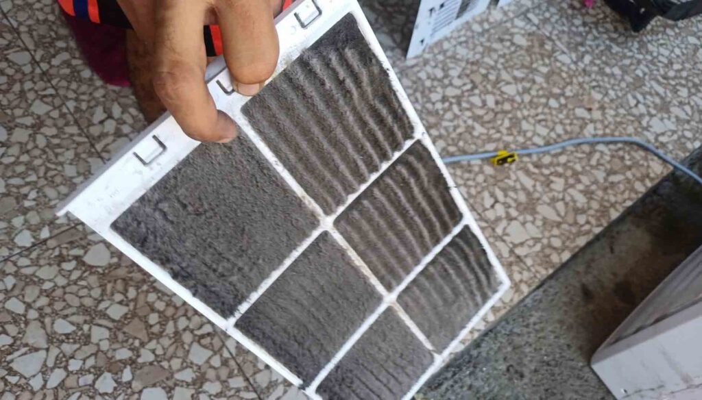 Replacing a dirty HVAC air filter to improve indoor air quality