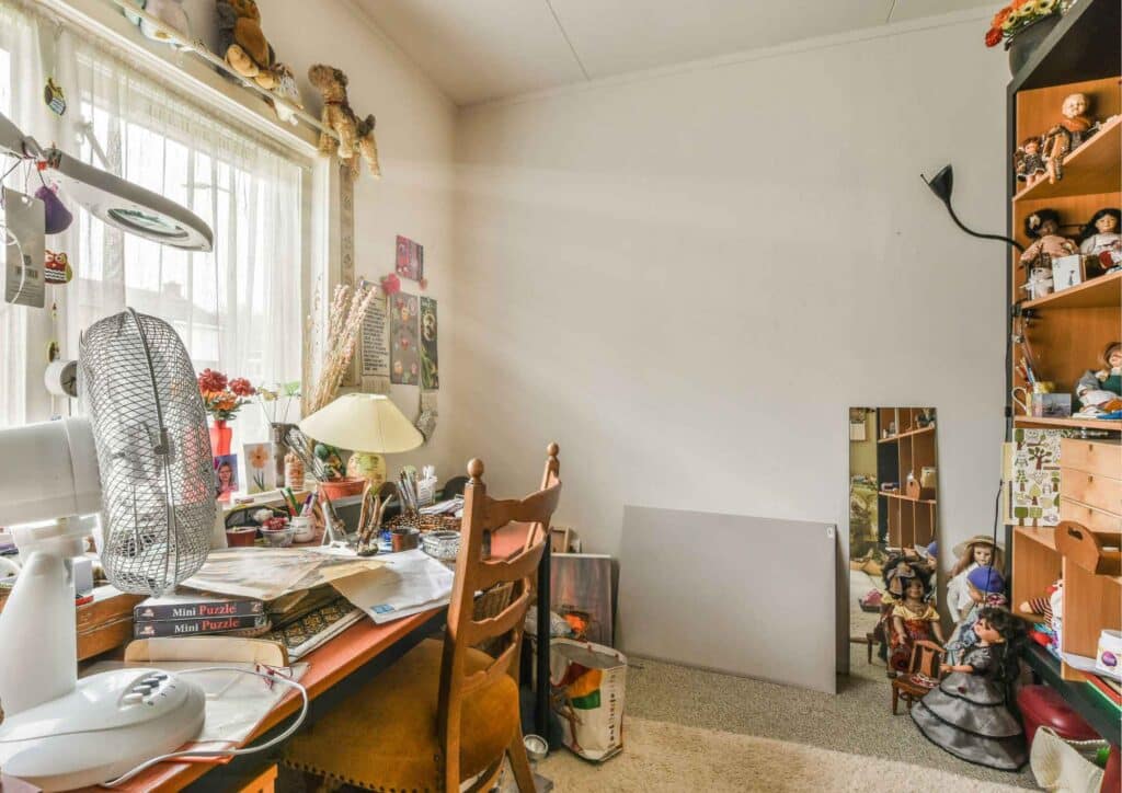 Overdecorated room with mixed styles that looks cluttered