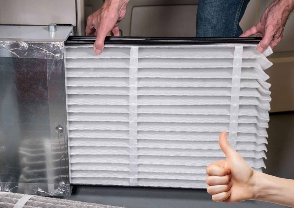 HVAC professional inspecting airflow and ductwork to identify dust issues