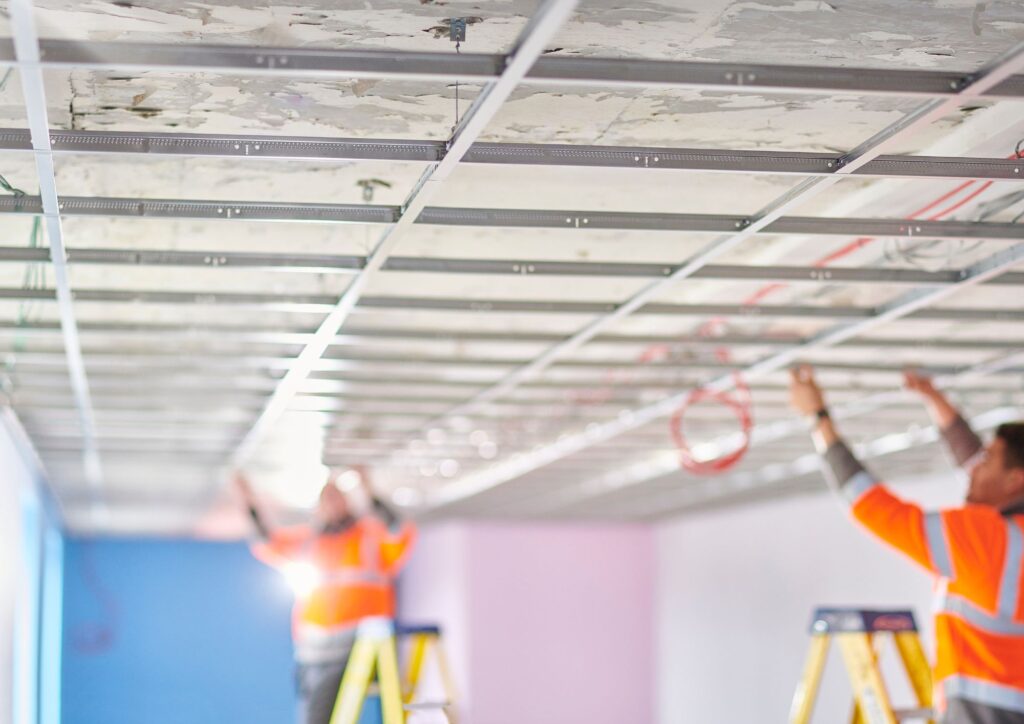 Suspended ceiling hanger wires neatly twisted using a ceiling wire twisting tool
