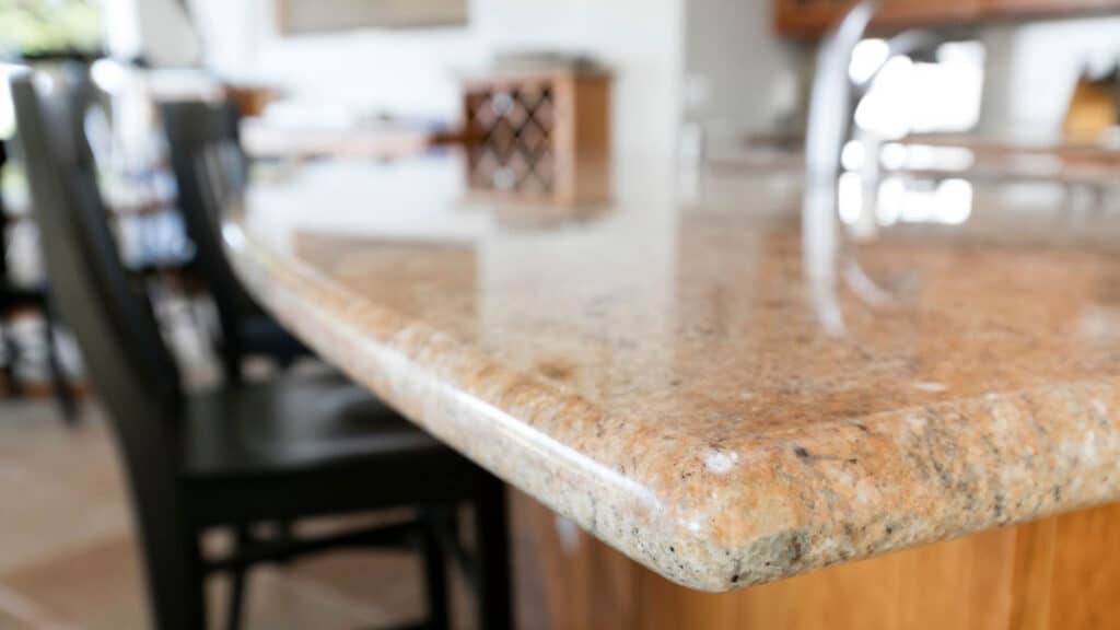 Chipped square granite countertop edge near sink cutout