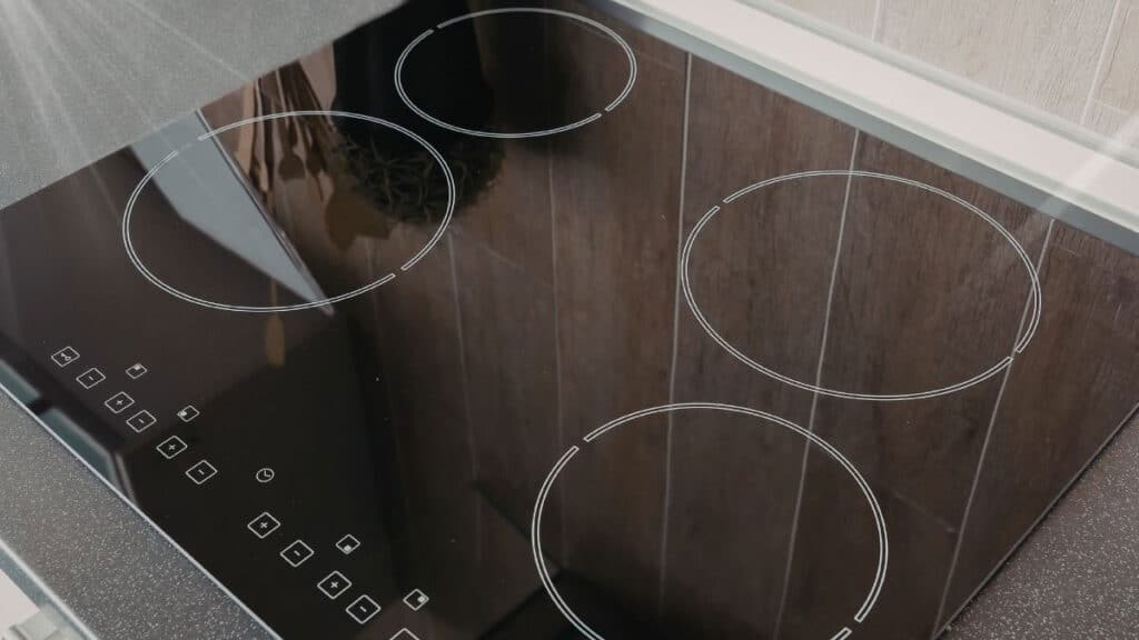 Clean ceramic glass top stove after removing burnt grease