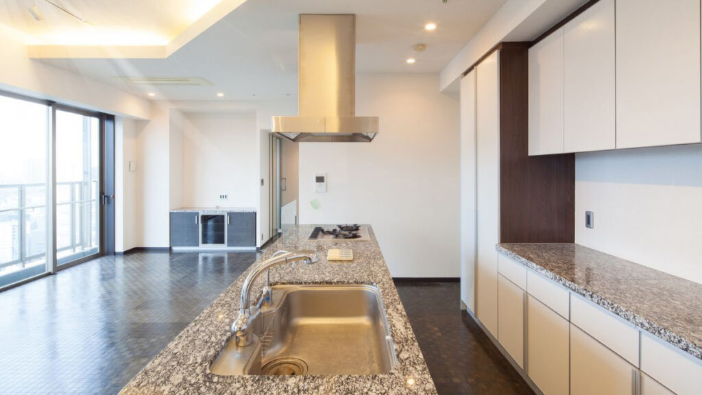 Engineered quartz kitchen worktop with undermount sink and uniform surface pattern