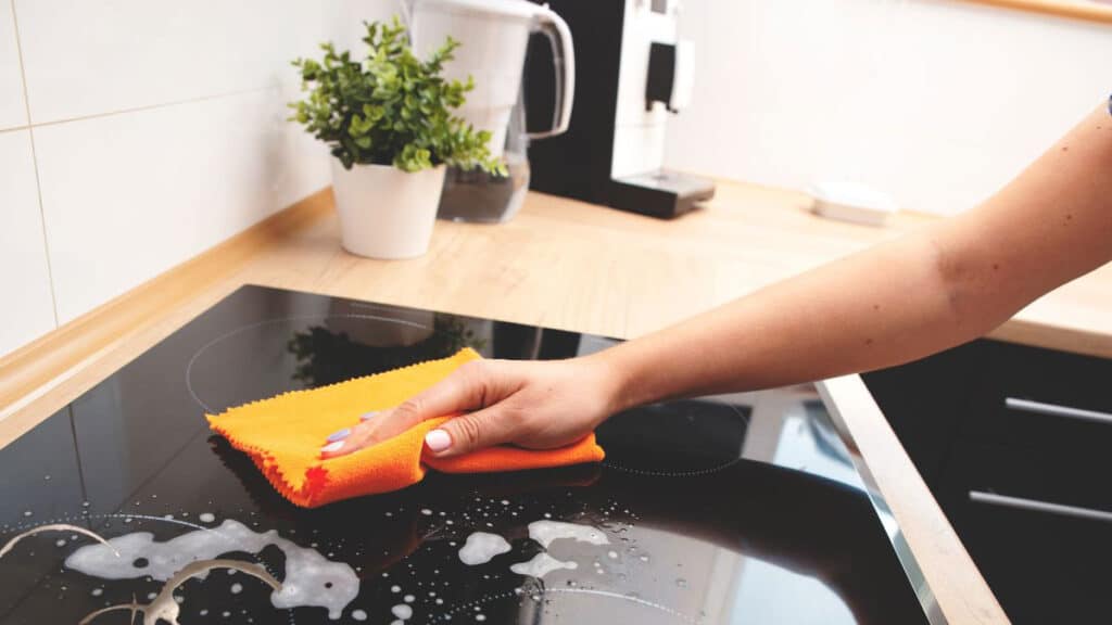 Burnt on grease buildup on a ceramic glass top stove before cleaning