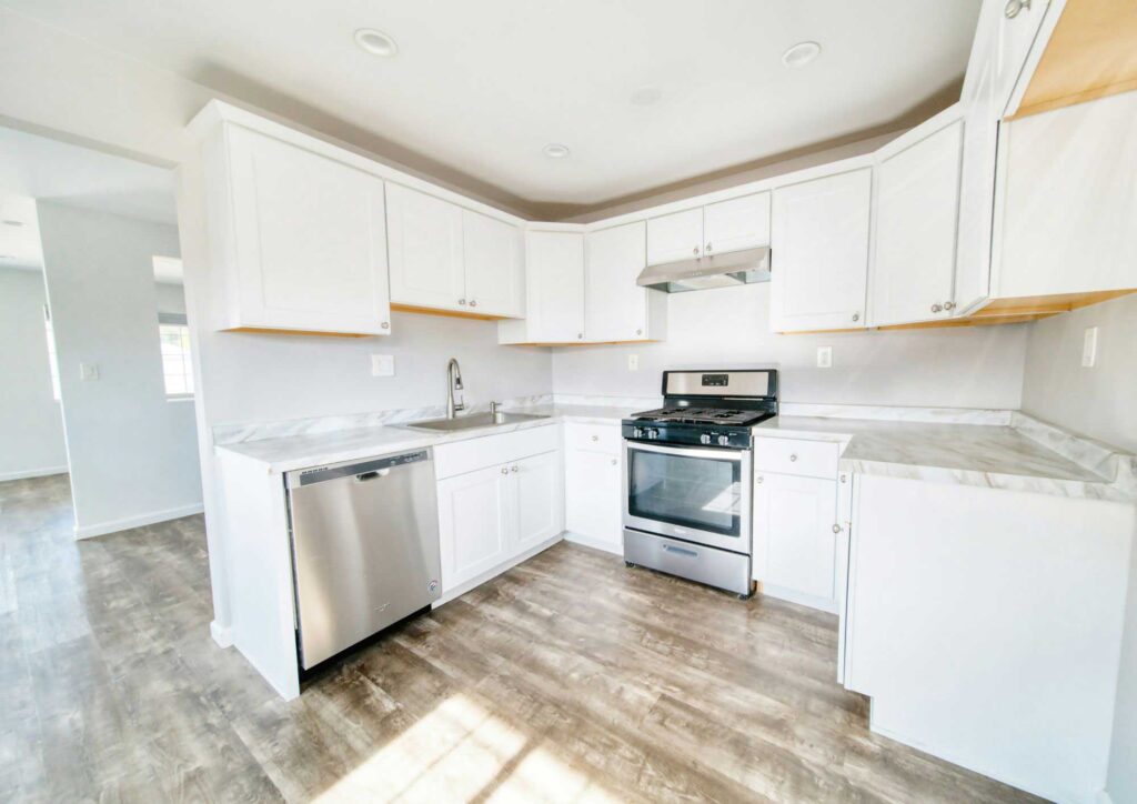 Beautifully remodeled kitchen with modern cabinets and countertops