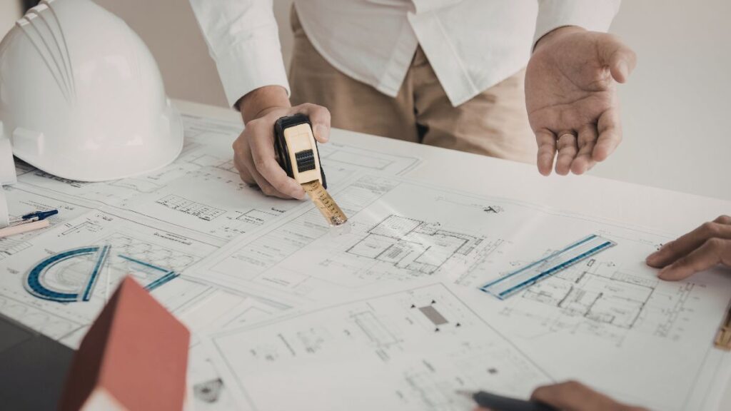 Planning a kitchen remodel budget with layout plans and material samples