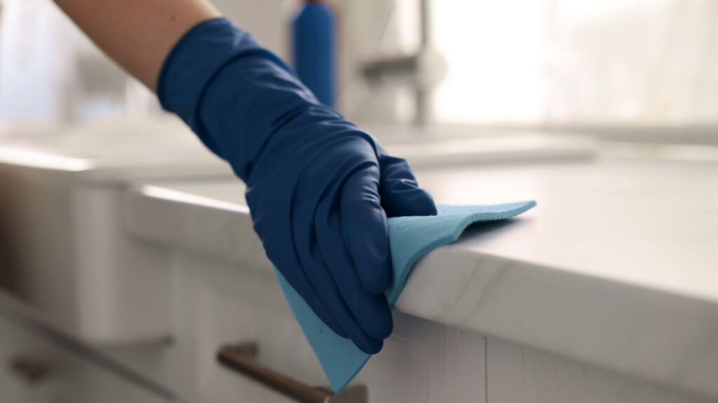 Applying granite sealer evenly with a soft cloth