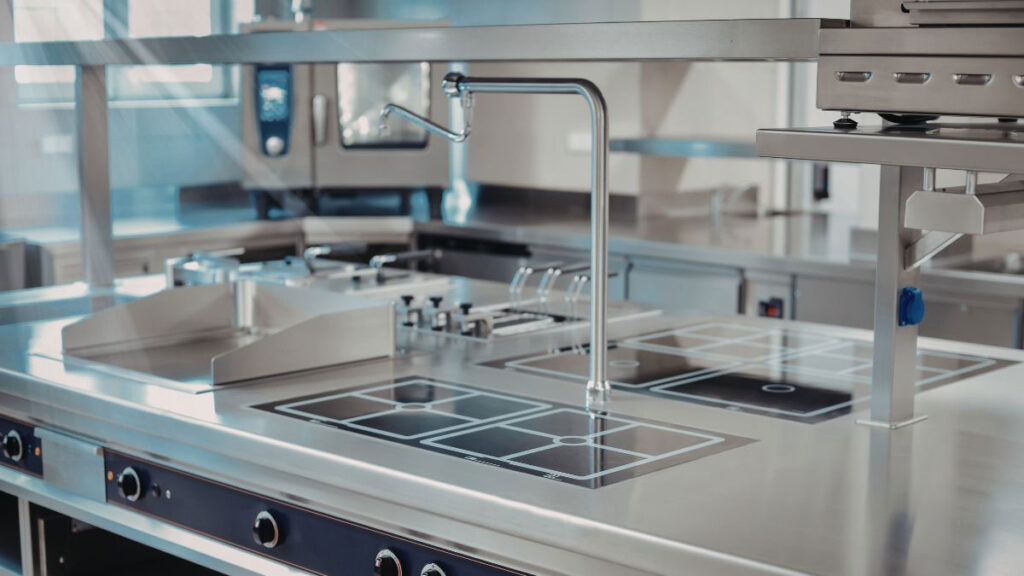 Stainless steel worktop overlay installed over existing kitchen cabinets