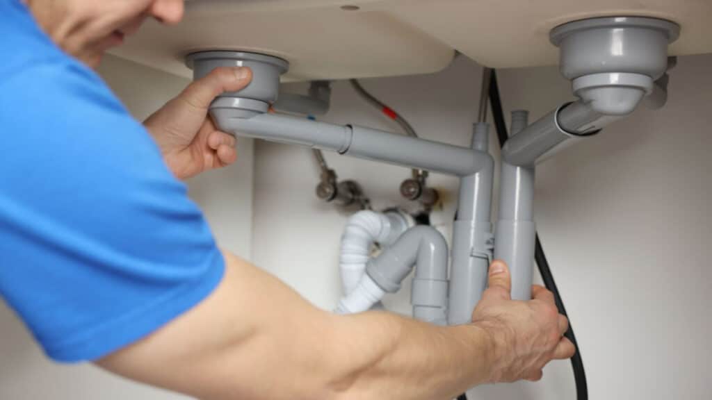 under sink plumbing with garbage disposal and p trap in 33 inch cabinet