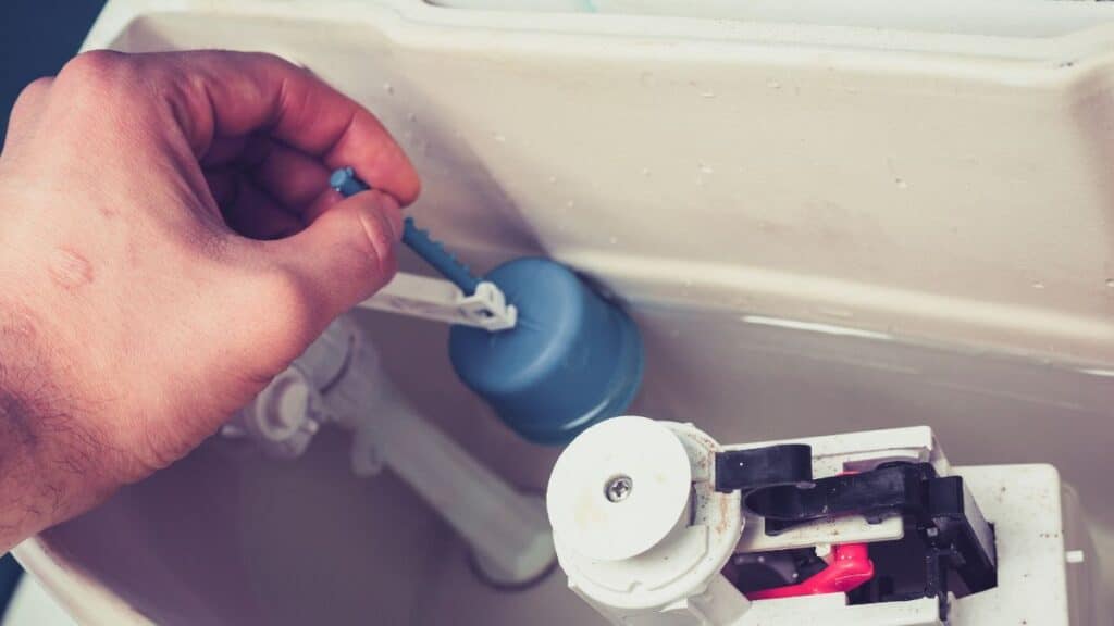 adjusting toilet float and fill valve water level inside tank