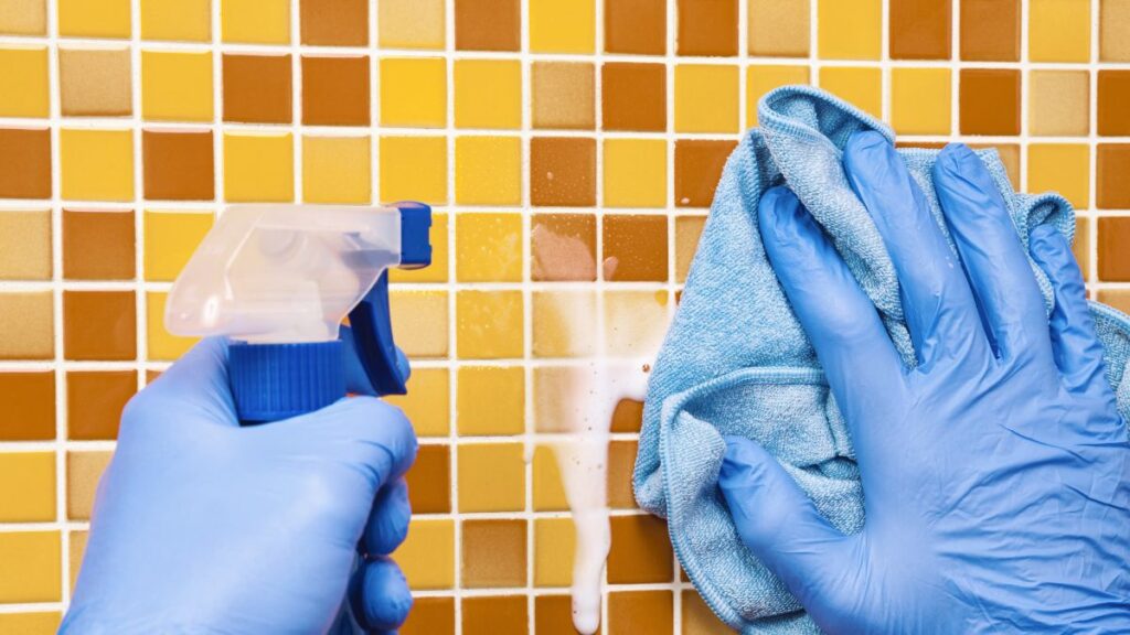 Baking soda and vinegar reaction on shower tile during cleaning process