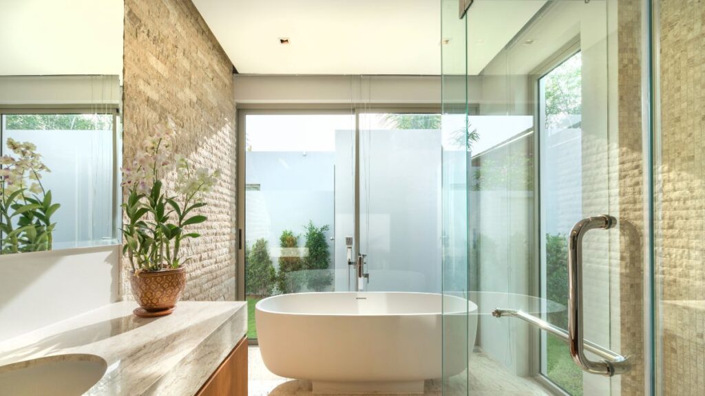 Clean bathroom with spotless shower, toilet, and fixtures after vinegar cleaning