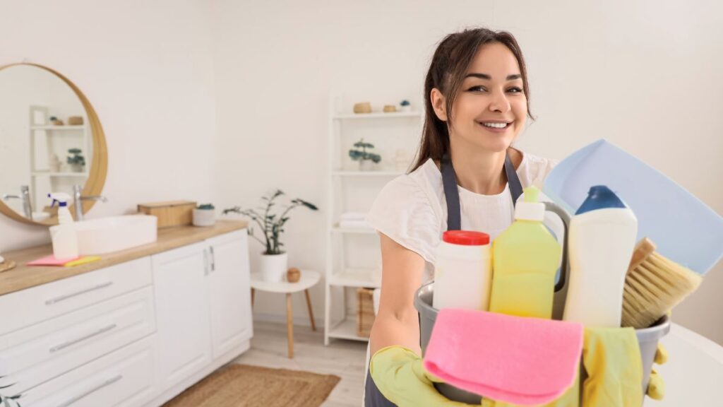 Removing items and debris before cleaning bathroom surfaces