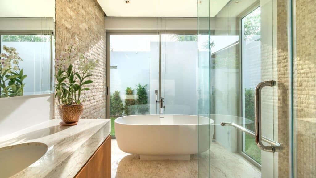 spotless modern bathroom with clean tiles glass shower and shiny fixtures