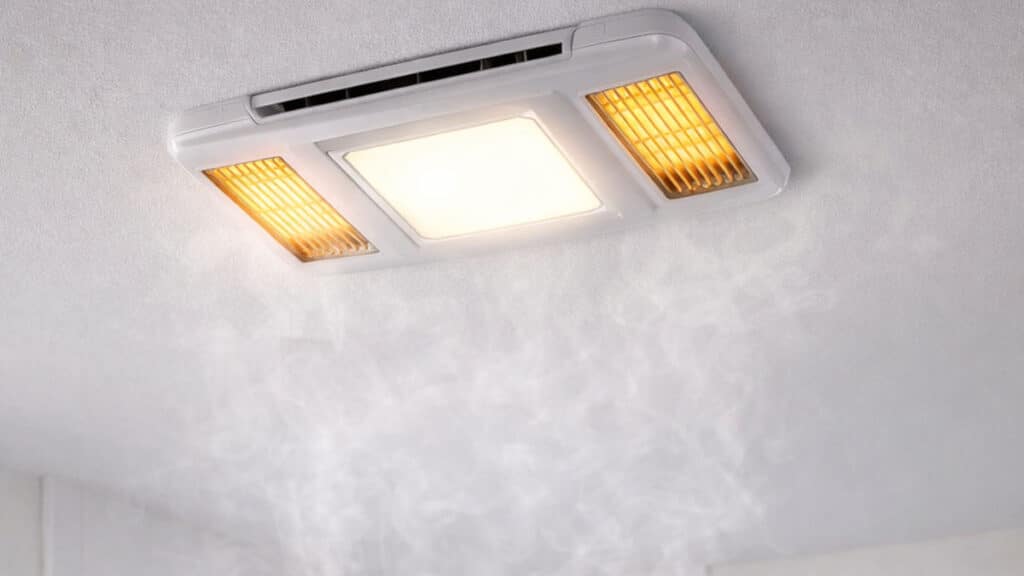 bathroom exhaust fan with heater installed in ceiling of modern bathroom