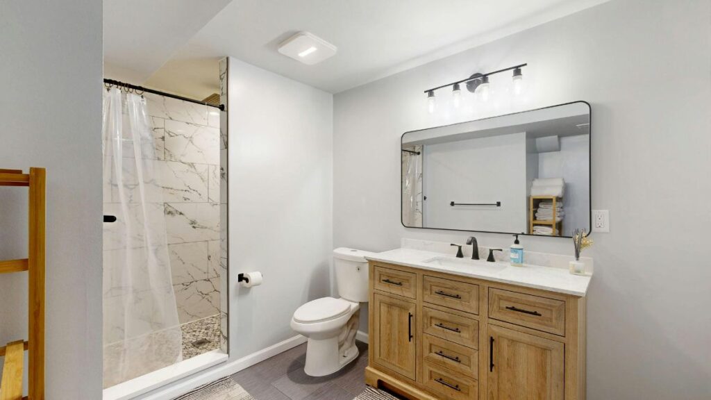 clean modern bathroom with spotless sink shower and toilet