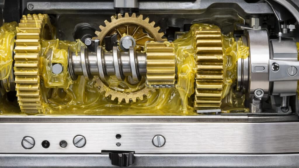 Diagram of stand mixer gearbox showing gears packed with grease lubrication