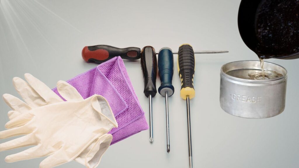 Tools needed for KitchenAid mixer grease replacement including screwdrivers and food grade grease