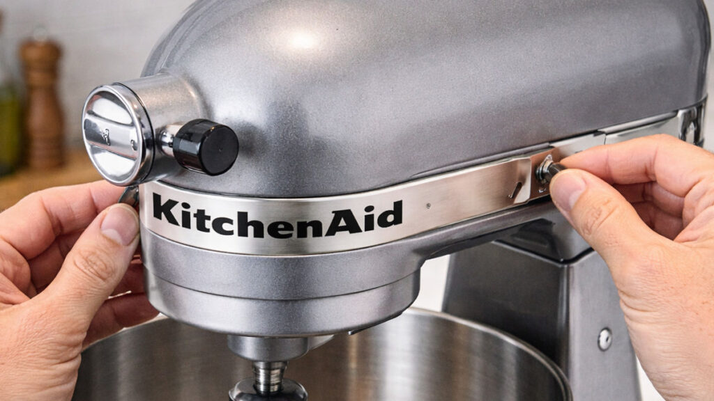 Removing trim band from KitchenAid stand mixer to access housing screws
