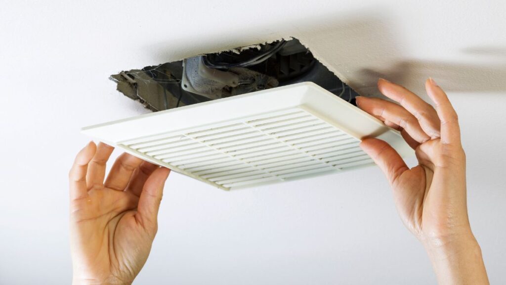 removing bathroom exhaust fan cover with spring clips