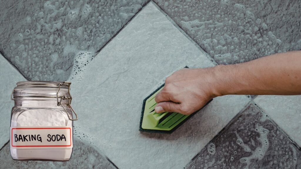 Scrubbing shower tile with baking soda to remove soap scum