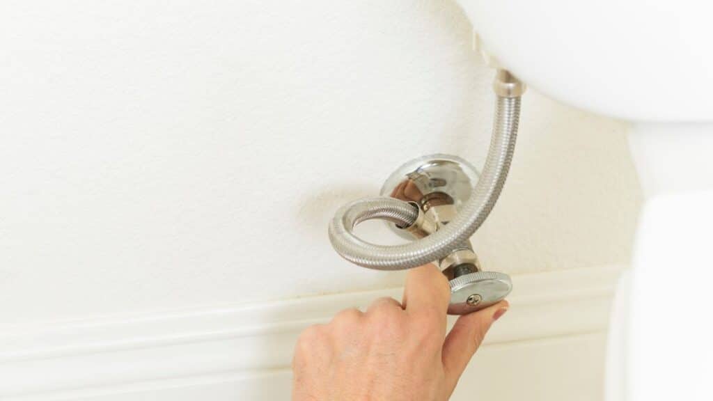 Toilet shutoff valve and water supply line connection at wall