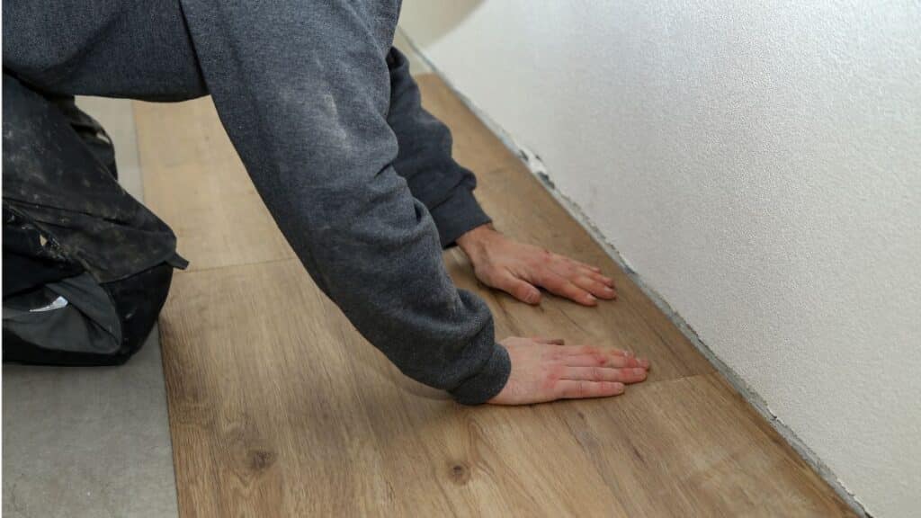 luxury vinyl plank flooring installed over concrete slab in living room